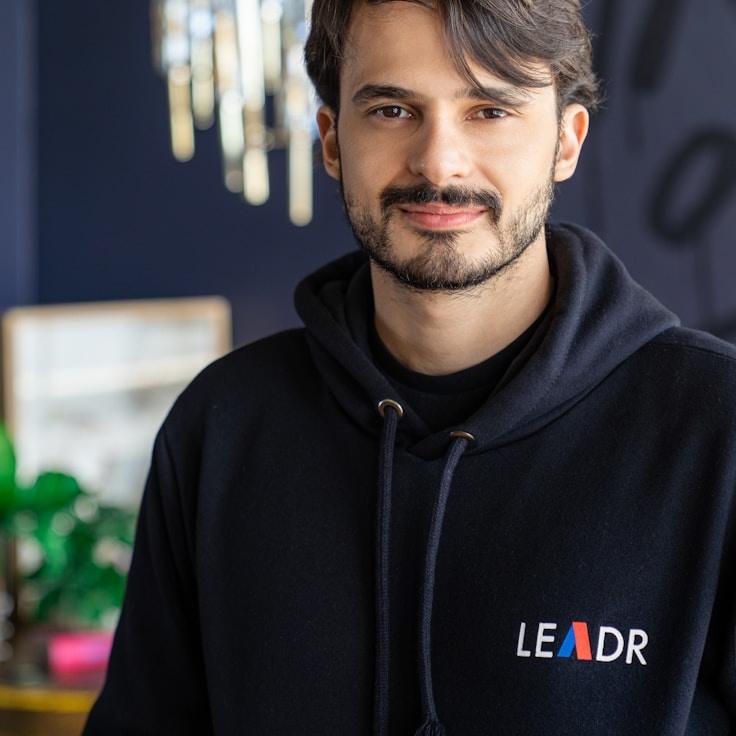 Kaveri Mehta, Lead Design Curator at Bloom Harbor Quill, reviewing corporate floral arrangements